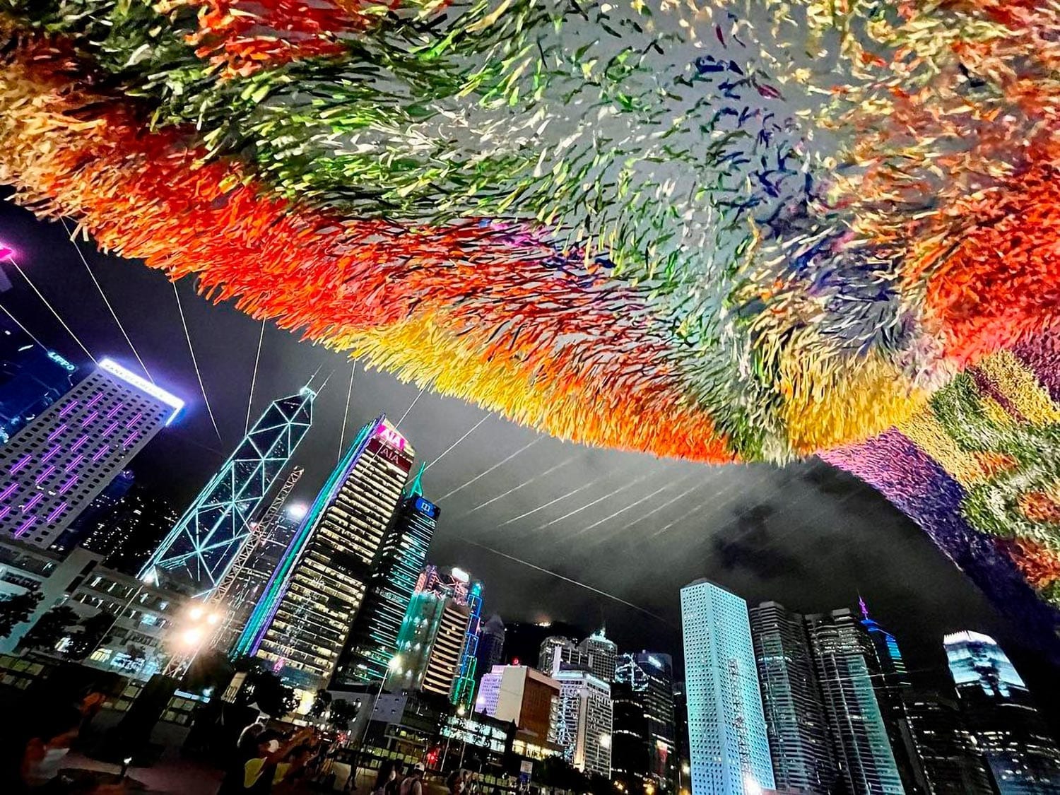 River of Light kinetic installation by Poetic Kinetics over Hong Kong's Central Harbourfront at night