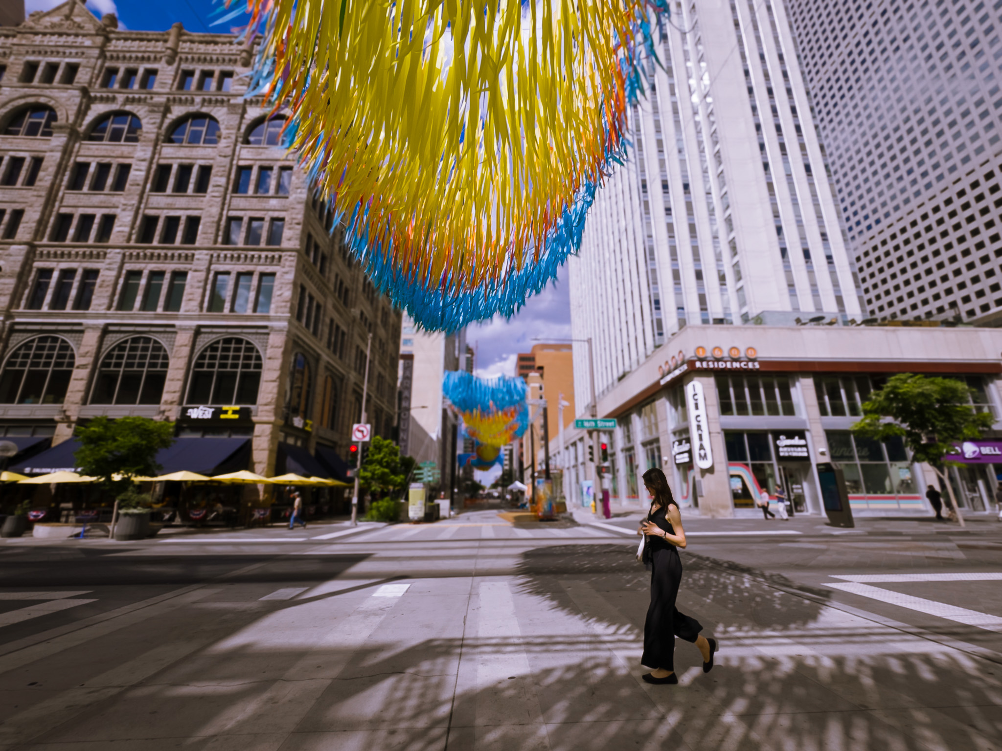 Quaking Gold kinetic installation suspended above Glenarm Plaza in downtown Denver