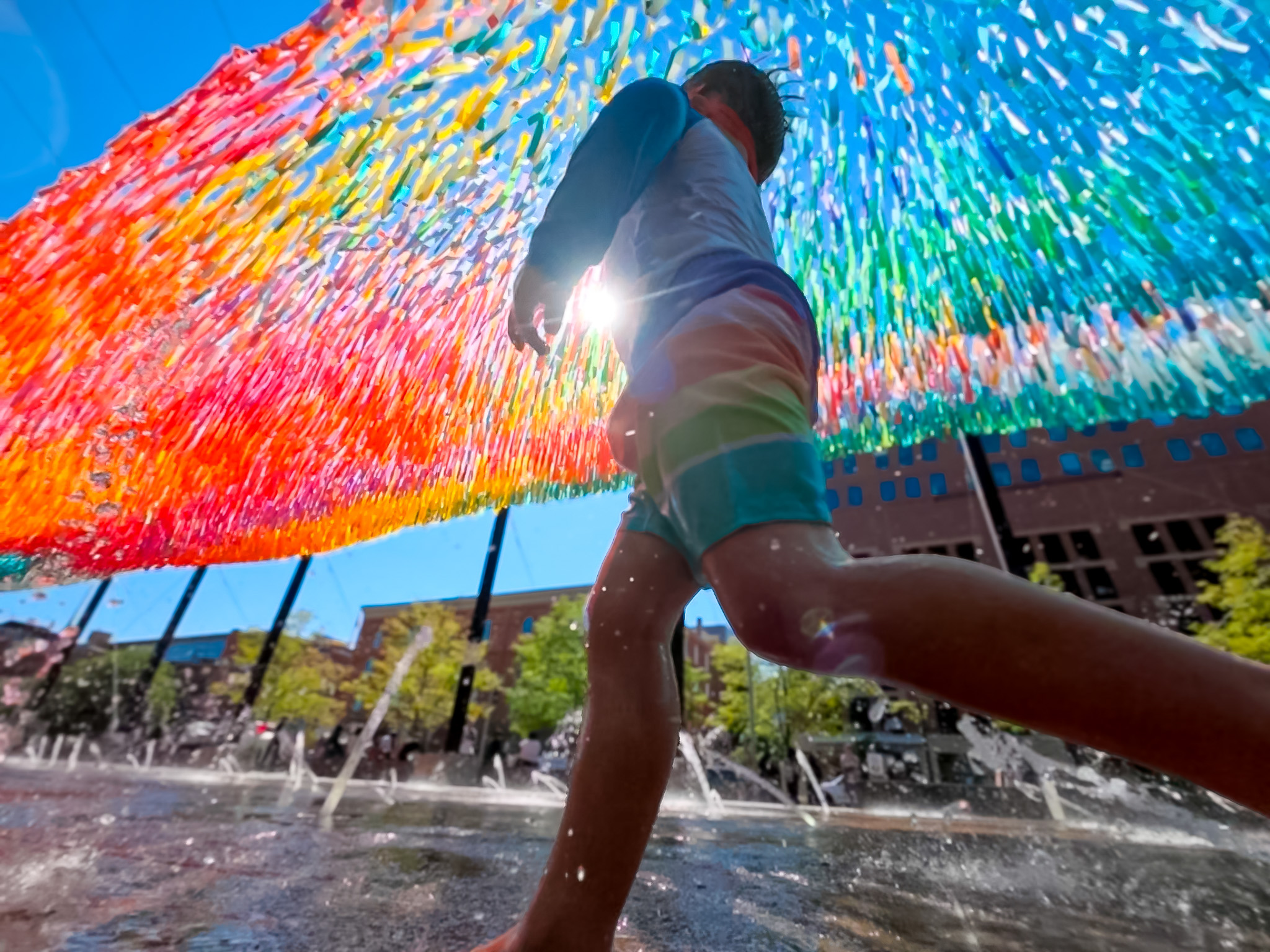 Sun Splash kinetic Skynet installation above the fountains at Denver Union Station